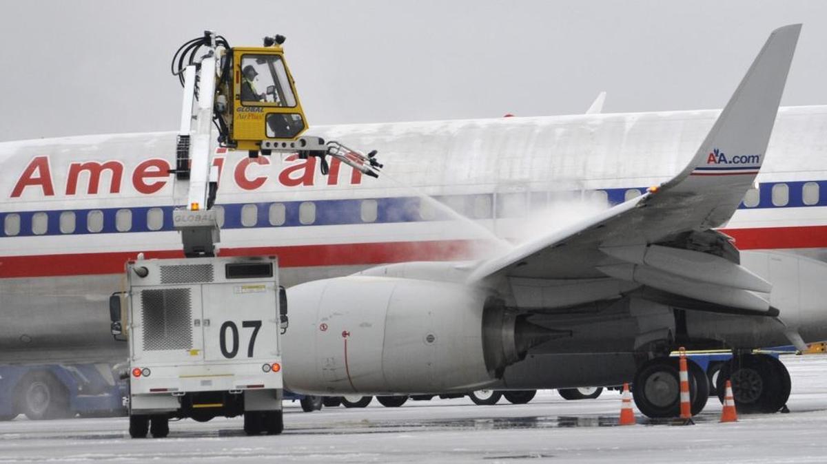 An American Airlines jet is deiced early Tuesday morning, Feb. 17, 2015.