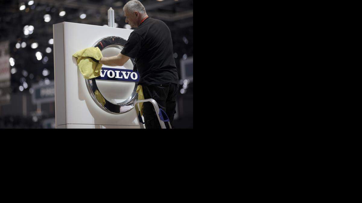 
A worker cleans a Volvo logo as it sits on a sign at the Volvo Cars display stand, ahead of the 85th Geneva International Motor Show in Geneva, Switzerland, this week. Volvo soon could drive into South Carolina with a manufacturing plant, likely in the Charleston area, four state legislators told The (Columbia) State on Wednesday.
