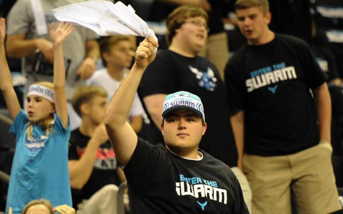 Charlotte Hornets fans cheer before a playoff game against the Miami Heat in April.
