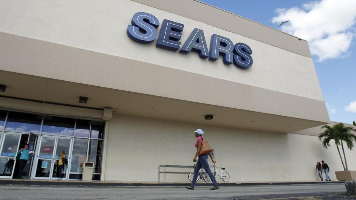 FILE- In this Nov. 9, 2012, photo, a Sears store is shown in Hialeah, Fla. Sears Holdings Corp. is announcing Thursday, April 21, 2016, that it will close 68 Kmart stores and 10 Sears stores as it struggles to restore profitability. The company also announced it is closing its call center in High Point.