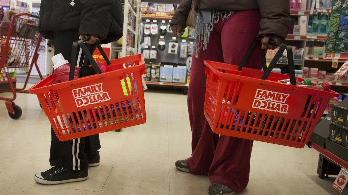 Shoppers wait in line at a Family Dollar Stores Inc. store in Belleville, New Jersey, U.S., on Thursday, Jan. 3, 2013.