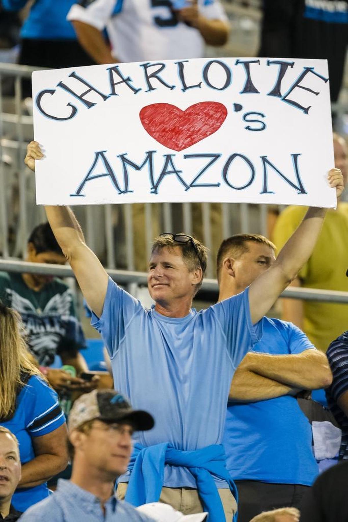 A Carolina Panther fan shows his desire for Amazon to make Charlotte it's East Coast headquarters before an NFL football game against the Philadelphia Eagles in Charlotte, N.C., Thursday, Oct. 12, 2017. The Eagles won 28-23.