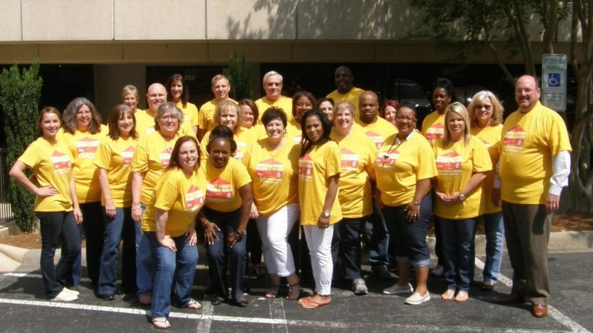 Team OrthoCarolina, seen here supporting the Ronald McDonald House, logs several hundred hours of volunteer time at local charities around the Charlotte area.