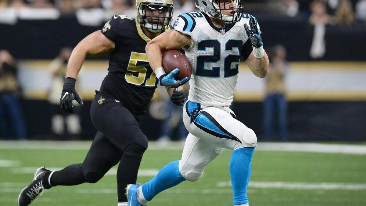 Carolina Panthers running back Christian McCaffrey rushes for a touchdown following a pass reception from quarterback Cam Newton during a season-ending loss to the New Orleans Saints. Panthers owner Jerry Richardson has said the team will go on sale after the last game was played.