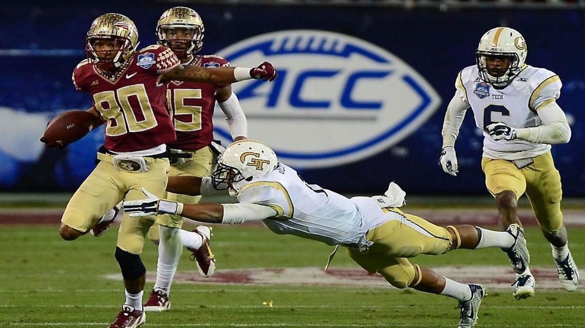 Florida State's Rashad Greene eludes a tackle from Georgia Tech's Isaiah Johnson during the fourth quarter of the 2014 ACC Championship game at Bank of America Stadium.