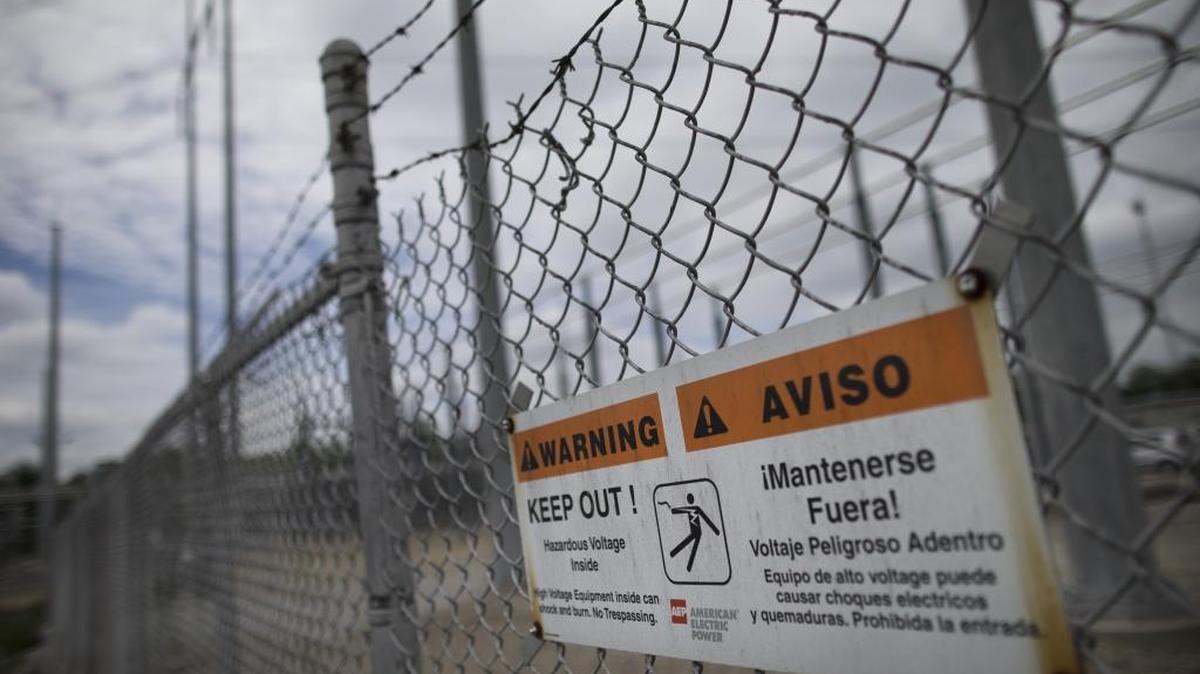 A barbed wire fence surrounds an AEP electrical transmission substation in Westerville, Ohio. Around the country, sophisticated foreign hackers have gained enough remote access about a dozen times in the last decade to control the operations networks that keep the lights on, the Associated Press found. Duke Energy, as the power supplier to more than 7 million customers in six Southeast and Midwest states, finds its computer systems under constant attack, Duke Energy Executive Vice President A.R. Mullinax said.