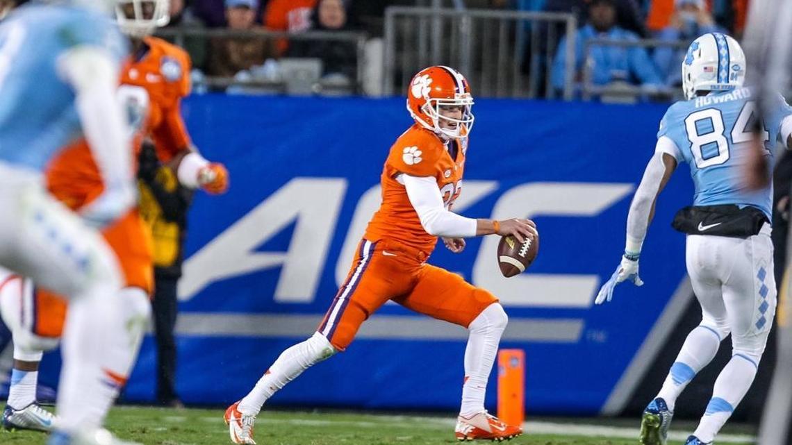 Clemson punter Andy Teasdale tries to pass on a fouth down in the first half of the ACC Championship game at Bank of America Stadium, in Charlotte on Dec. 5, 2015.