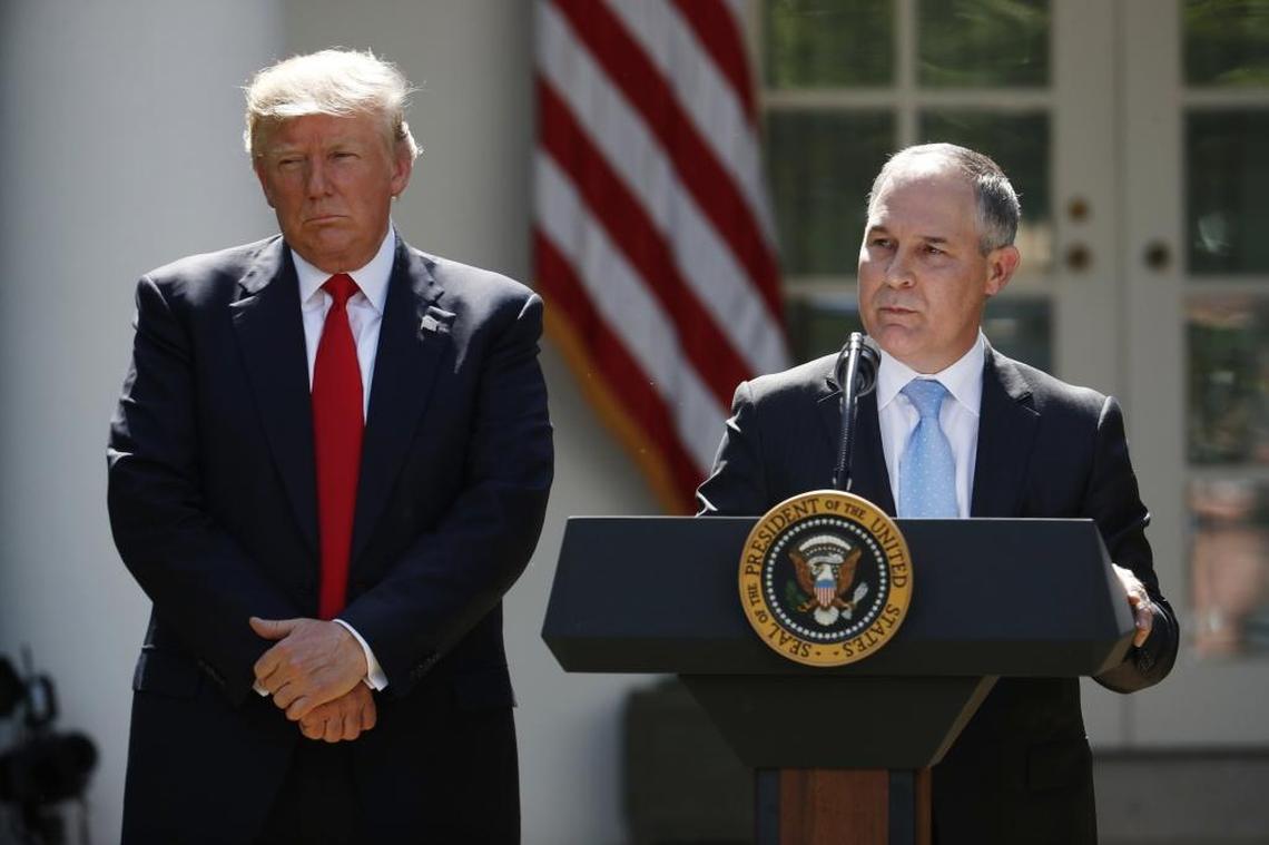In this June 1 photo, President Donald Trump listens as EPA Administrator Scott Pruitt speaks about the U.S. role in the Paris climate change accord in the Rose Garden of the White House in Washington.