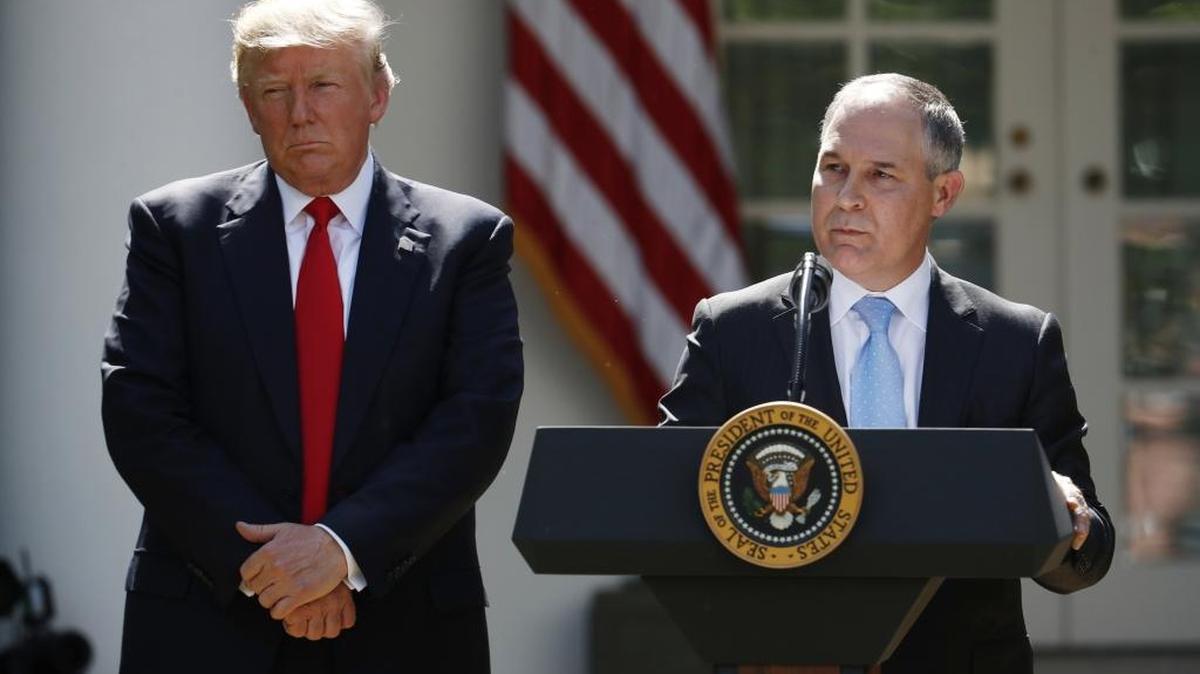 In this June 1 photo, President Donald Trump listens as EPA Administrator Scott Pruitt speaks about the U.S. role in the Paris climate change accord in the Rose Garden of the White House in Washington.