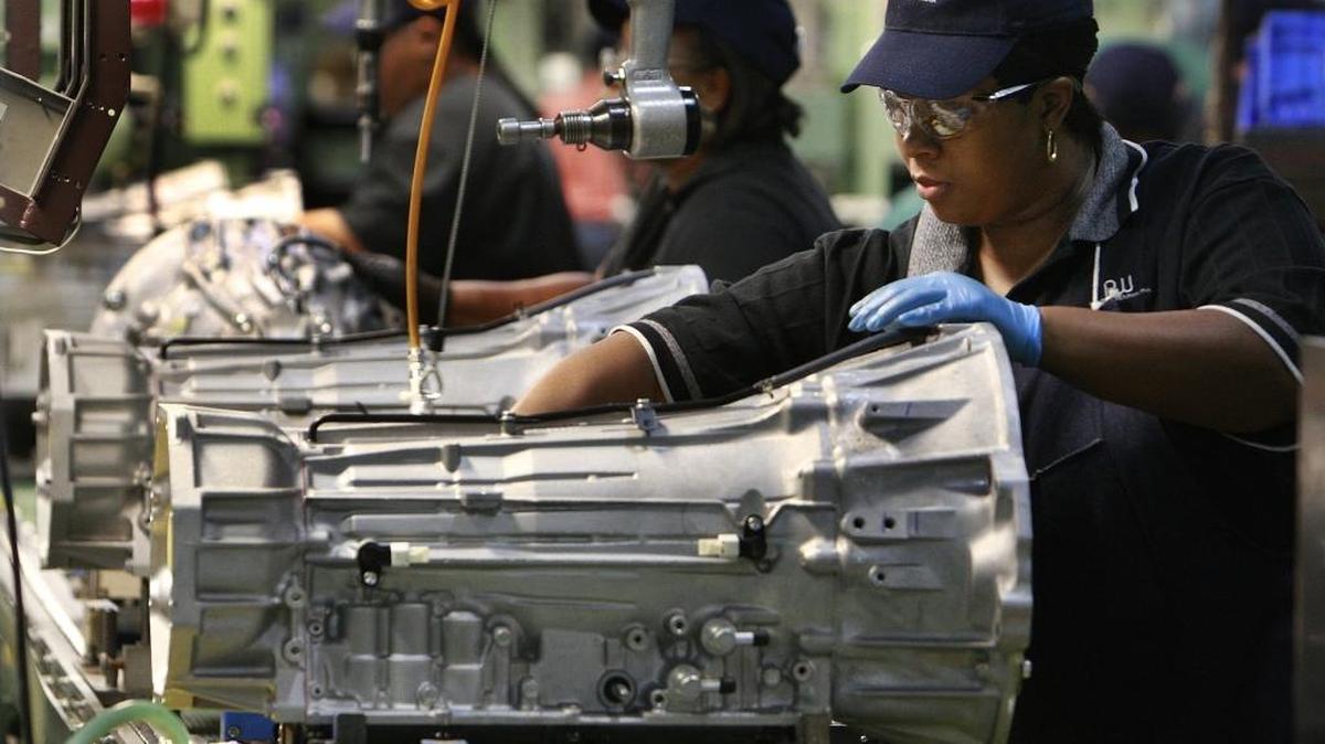 Frances Keene puts a neutral safety switch on a transmission at the AW North Carolina plant in Durham in 2008. The plant is one of many North Carolina operations that supply the auto industry with parts.