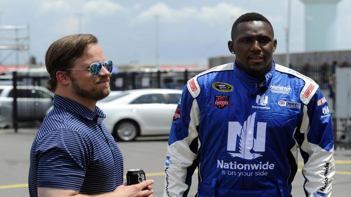 In this file photo, Marcus Smith, president of Charlotte Motor Speedway, left, and Carolina Panthers linebacker Thomas Davis talk prior to Davis taking laps around the track at Charlotte Motor Speedway in May. In 2013, Smith an effort to land the summer X Games at the speedway, but Austin, Texas, won the bid.