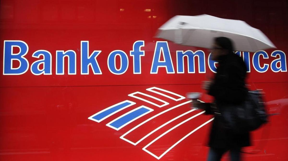 A woman passes a Bank of America office branch in New York in this file photo.