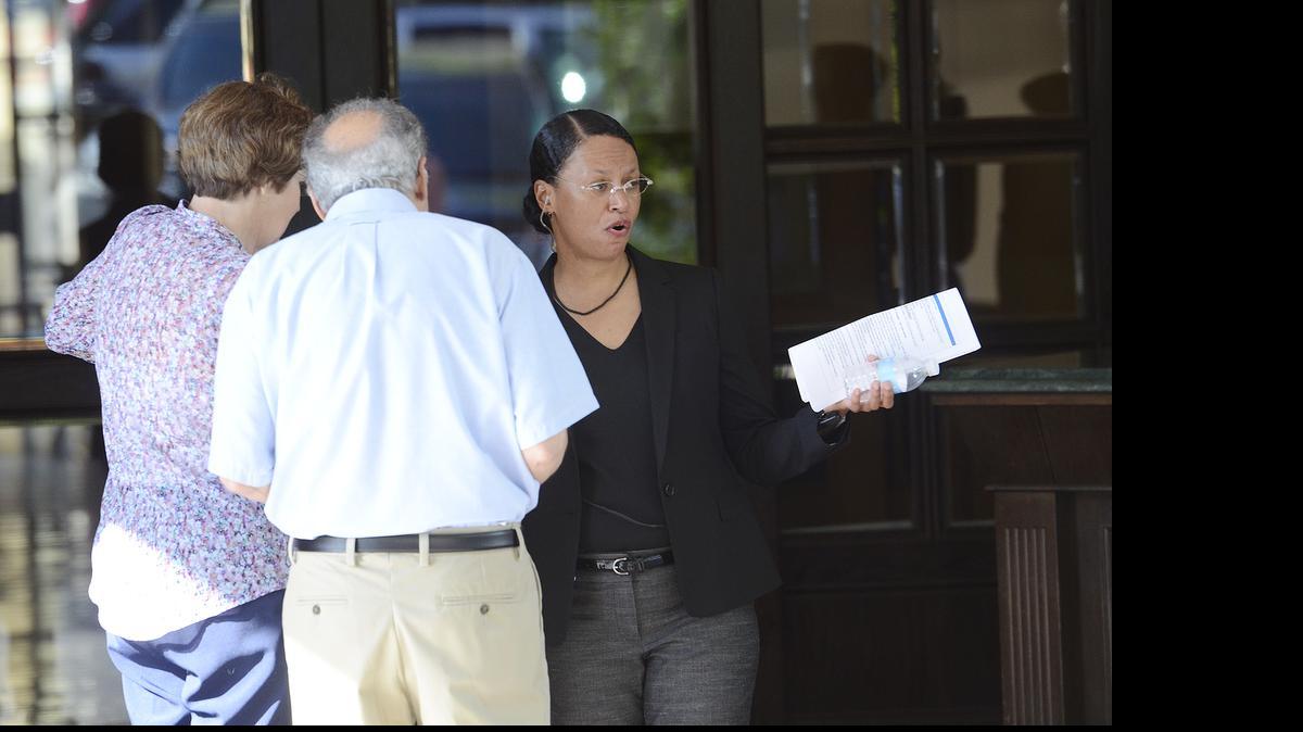 
Toria Burch, who works in marketing for Bank of America, volunteered as a greeter Wednesday morning at the bank’s annual shareholder meeting. 
