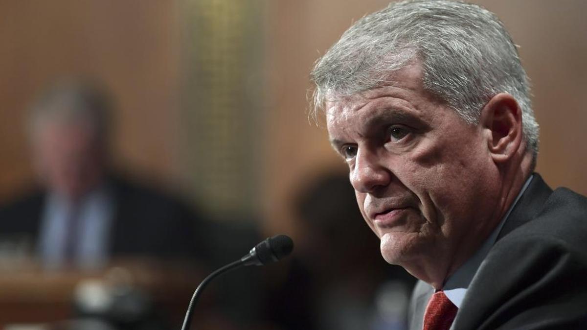 Wells Fargo CEO Timothy Sloan testifies before a Senate hearing on the bank’s sales scandal in this October 2017 file photo.