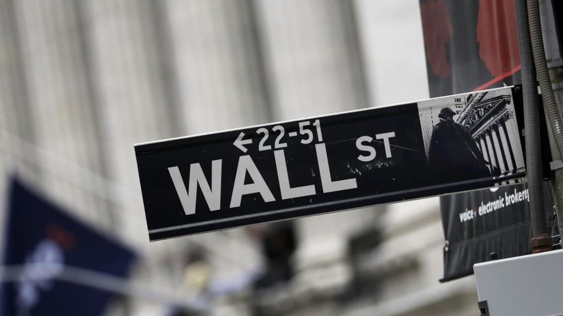 Wall Street executives would have to wait at least four years to collect most of their bonus pay and could be forced to return money if their companies lose big under rules being proposed to install one of the last major planks of the Dodd-Frank Act.
