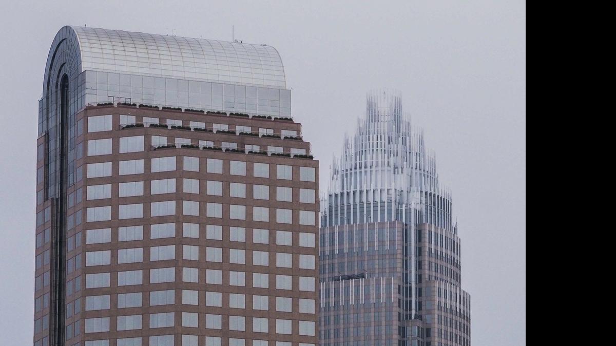 
Wells Fargo and Bank of America tower over uptown Charlotte. A little-noticed provision in North Carolina’s Senate budget could drive bank traders out of Charlotte – along with their multi-million dollar payrolls – a Mecklenburg County lawmaker warned Thursday.
