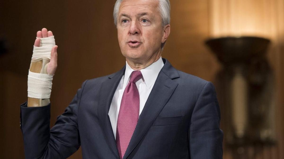John Stumpf, chairman and CEO of Wells Fargo, raises his hand as he is sworn in to testify about the unauthorized opening of accounts by Wells Fargo during a Senate Banking, Housing and Urban Affairs Committee hearing on Capitol Hill.