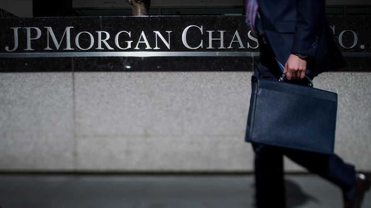 U.S. prosecutors on Tuesday announced expanded charges against two men that link them to a 2014 cyberattack against JPMorgan Chase that affected tens of millions of customers, as well as hacks against other companies and financial news organizations.