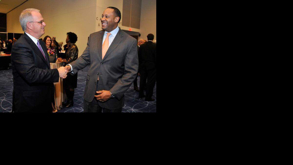 
Brett Carter, right, former senior vice president of Duke Energy Carolinas, has been named the new chief operating officer for Bank of America’s Global Technology and Operations unit. Carter will be based in Charlotte, where he will report to Cathy Bessant, the Charlotte-based head of the unit. Here he talks with Michael Tarwater, CEO of Carolinas HealthCare System, at the Charlotte Chamber’s 2013 annual meeting. 

