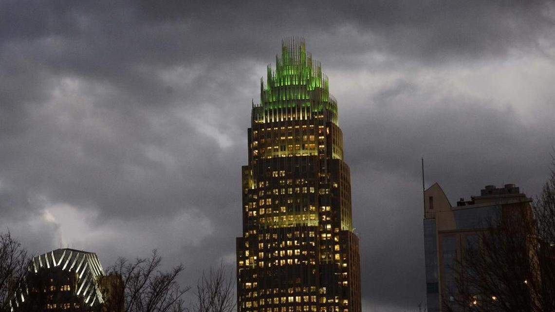 Bank of America has lit the top of its headquarters building green to support veterans.