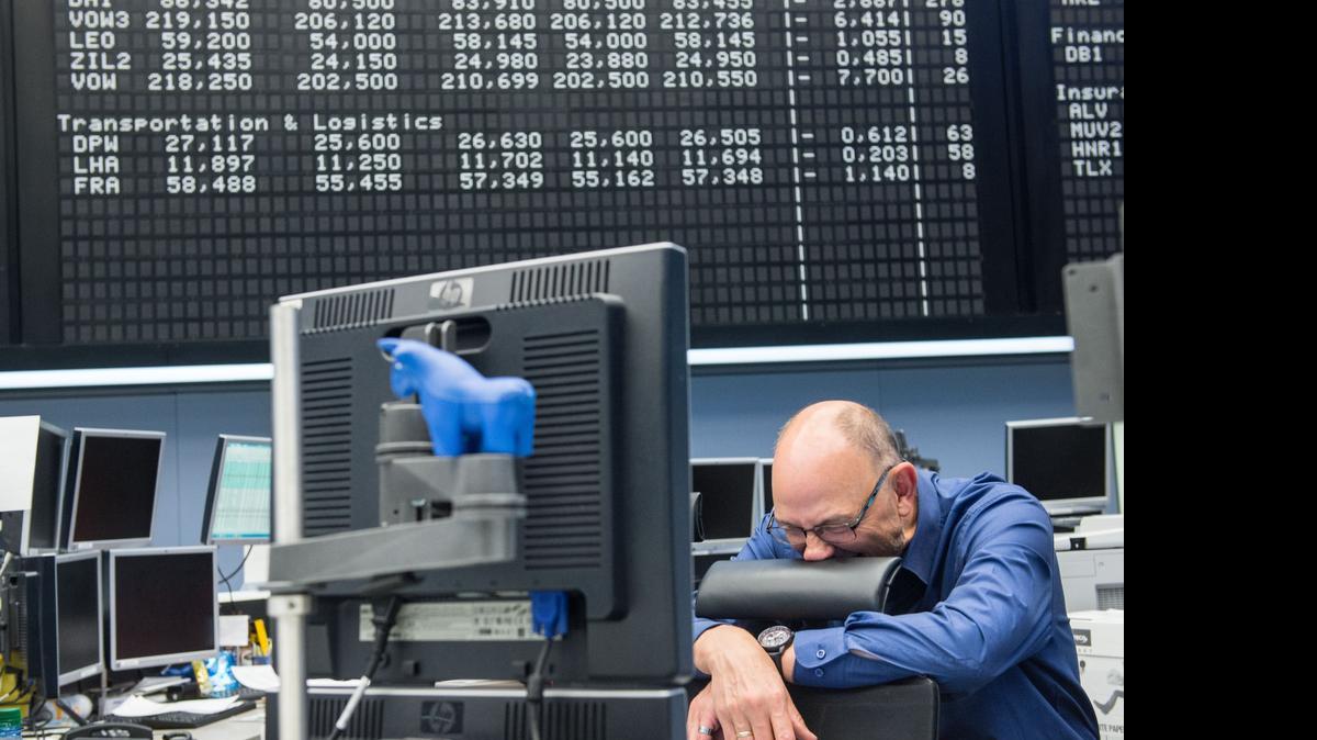 
A trader reacts after the day’s performance graph showed a sharp drop of the German DAX stock market index early today and a partial recovery later on the day after the European Central Bank announced it would not extend emergency funding to Greece on June 29, 2015 in Frankfurt, Germany. Meanwhile the Greek government ordered cash machines turned off and a tightening on the flow of capital in an effort to staunch citizens' withdrawals. 
