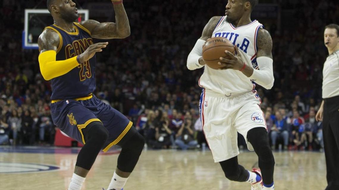 Robert Covington #33 of the Philadelphia 76ers controls the ball against LeBron James #23 of the Cleveland Cavaliers on January 10, 2016 at the Wells Fargo Center in Philadelphia, Pennsylvania. Firstrust Bank has signed a marketing deal with the Philadelphia 76ers, even though the NBA team plays in an arena emblazoned with the name of another bank – and will until 2024.
