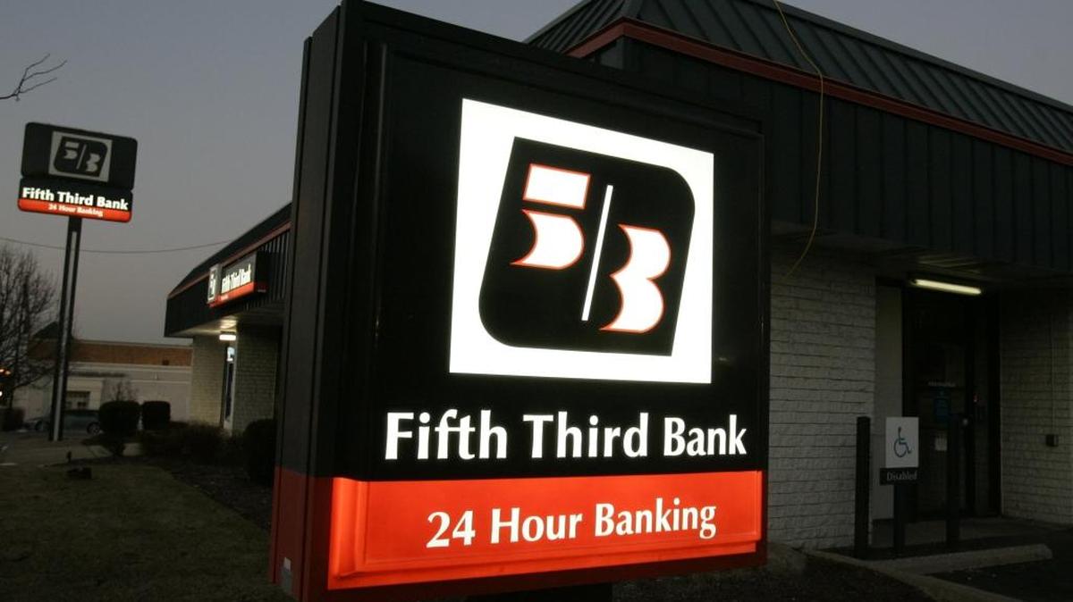 Signs outside a Fifth Third Bank are lit up at dusk in Cincinnati in this photo from 2009.