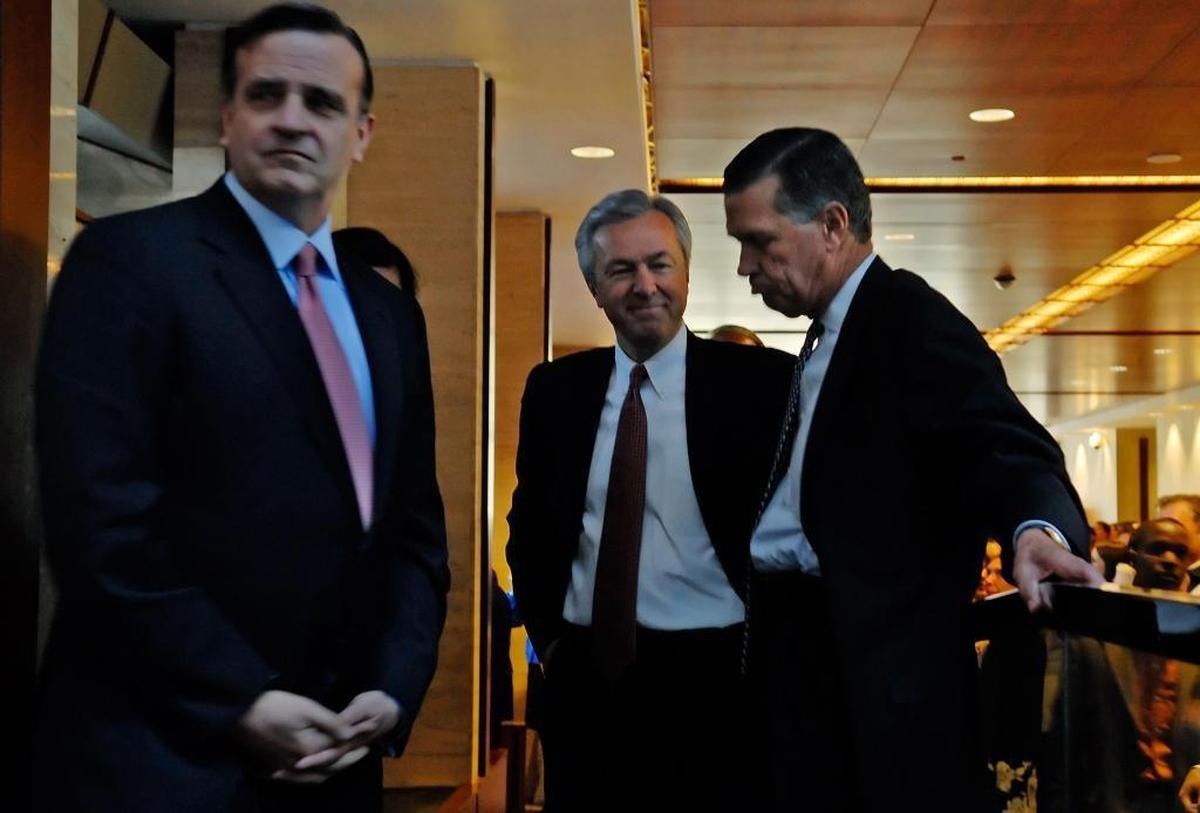 In October 2008, then-Wells Fargo CEO John Stumpf (center facing) takes a moment with Wachovia CEO Bob Steel (left) and former Wachovia executive Ben Jenkins before they met with employees about Wells Fargo’s takeover of Charlotte-based Wachovia. Stumpf was banned from the banking industry in January 2020.
