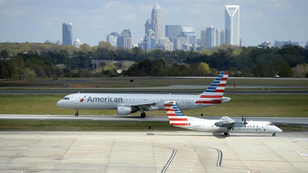 In this file photo, American Airlines airplanes taxi along at Charlotte Douglas International Airport.