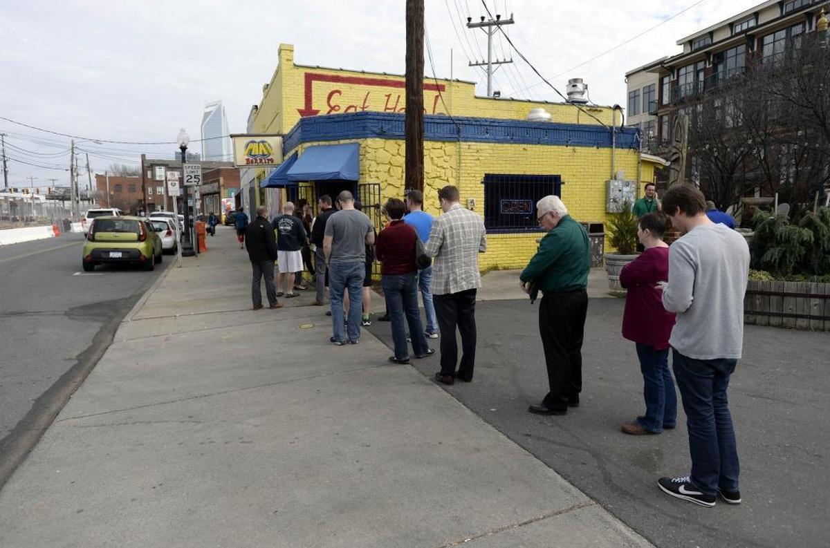 Customers line up outside of Phat Burrito on Thursday, February 2, 2017.