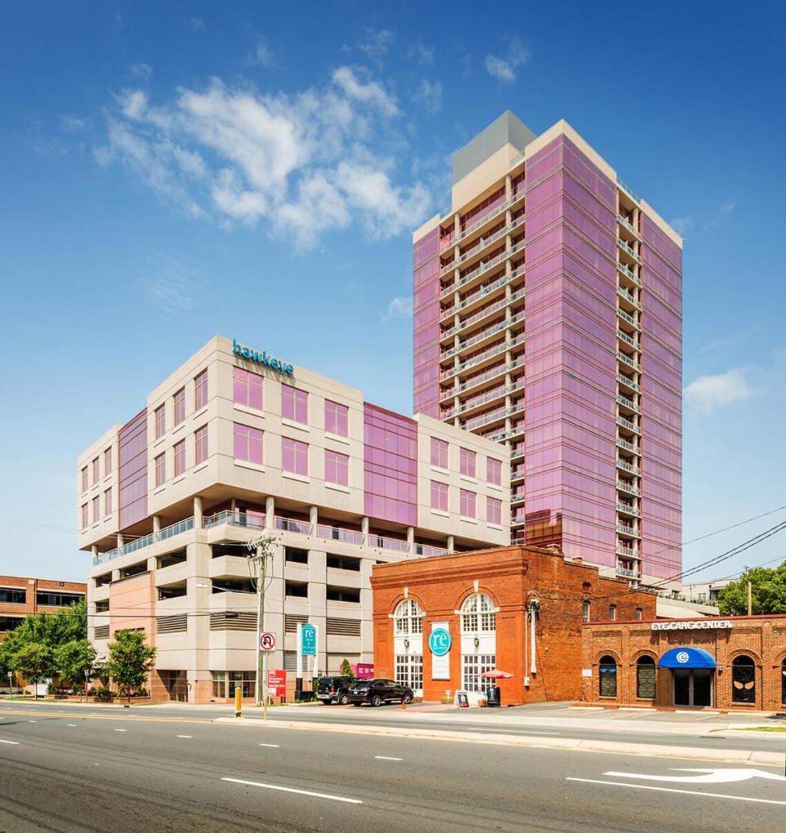 The Arlington “pink building” in South End. The office is on the left and the residential condo tower is on the right.