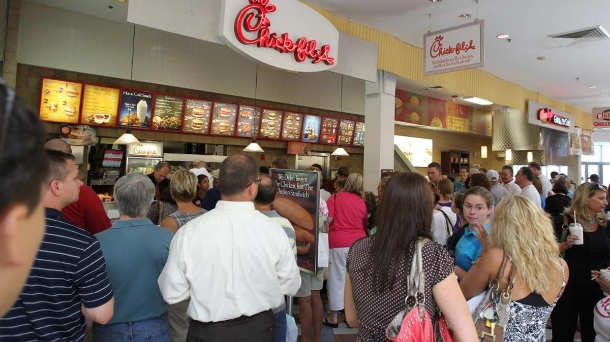 A large crowd of people, estimated at over a thousand, snaked through St. Clair Square in Fairview Heights, Ill. in a 2012 file photo.