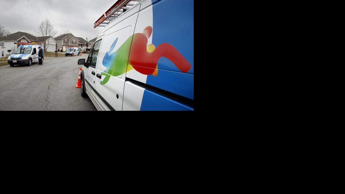 
Installers for Google Fiber confer while working in Kansas City, Kansas, in 2013.
