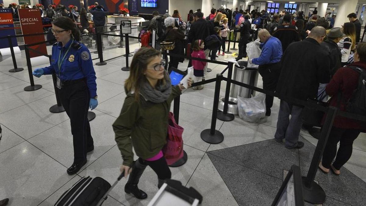 Holiday travelers brave the crowd and the weather at Charlotte Douglas International Airport Wednesday morning, Nov. 26, 2014. For the 2016 Christmas travel season, more travelers are flying this year compared to last year amid falling fare prices due to competition and more demand for air travel, according to airline industry experts. For 2016 Christmas travel, the average ticket price is down about 3.5 percent compared to last year, according to Chuck Thackston, managing director of enterprise information for the Arlington, Va.-based Airlines Reporting Corp.