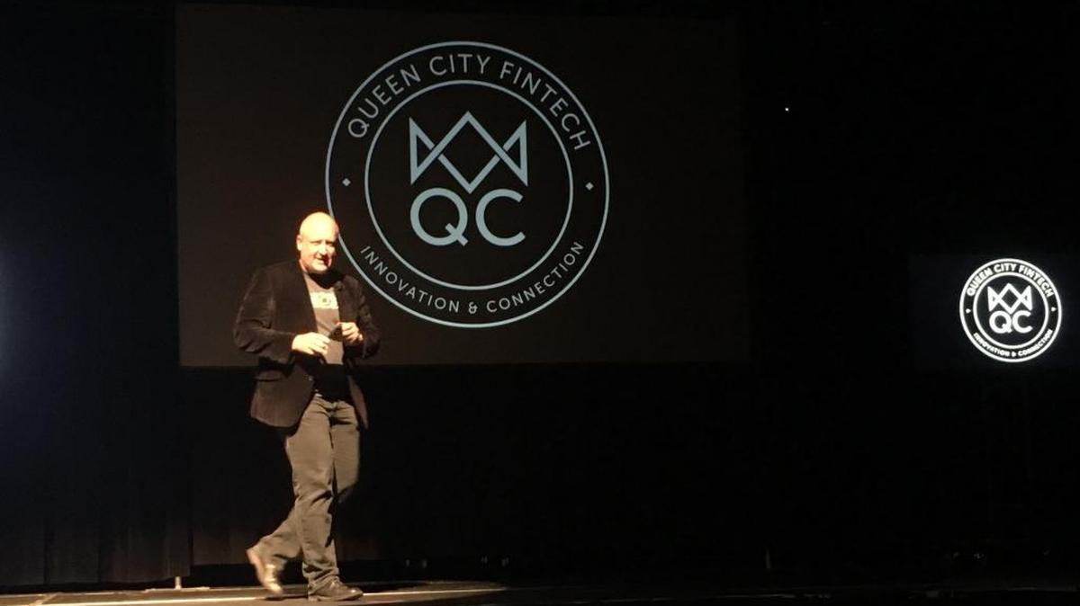 Dan Roselli presents to a packed audience at Queen City FinTech’s “Demo Day,” Wednesday.