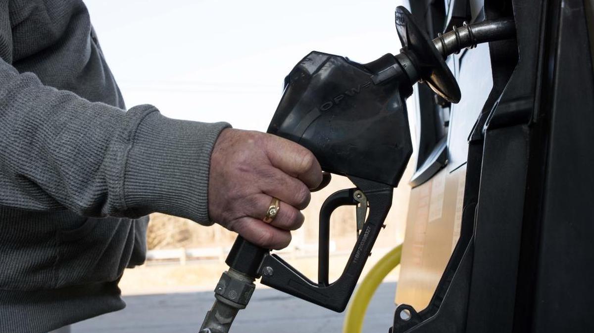 A customer prepares to pump fuel at a Go Mart Inc. gas station in Rockbridge, Ohio, U.S., in a February file photo.