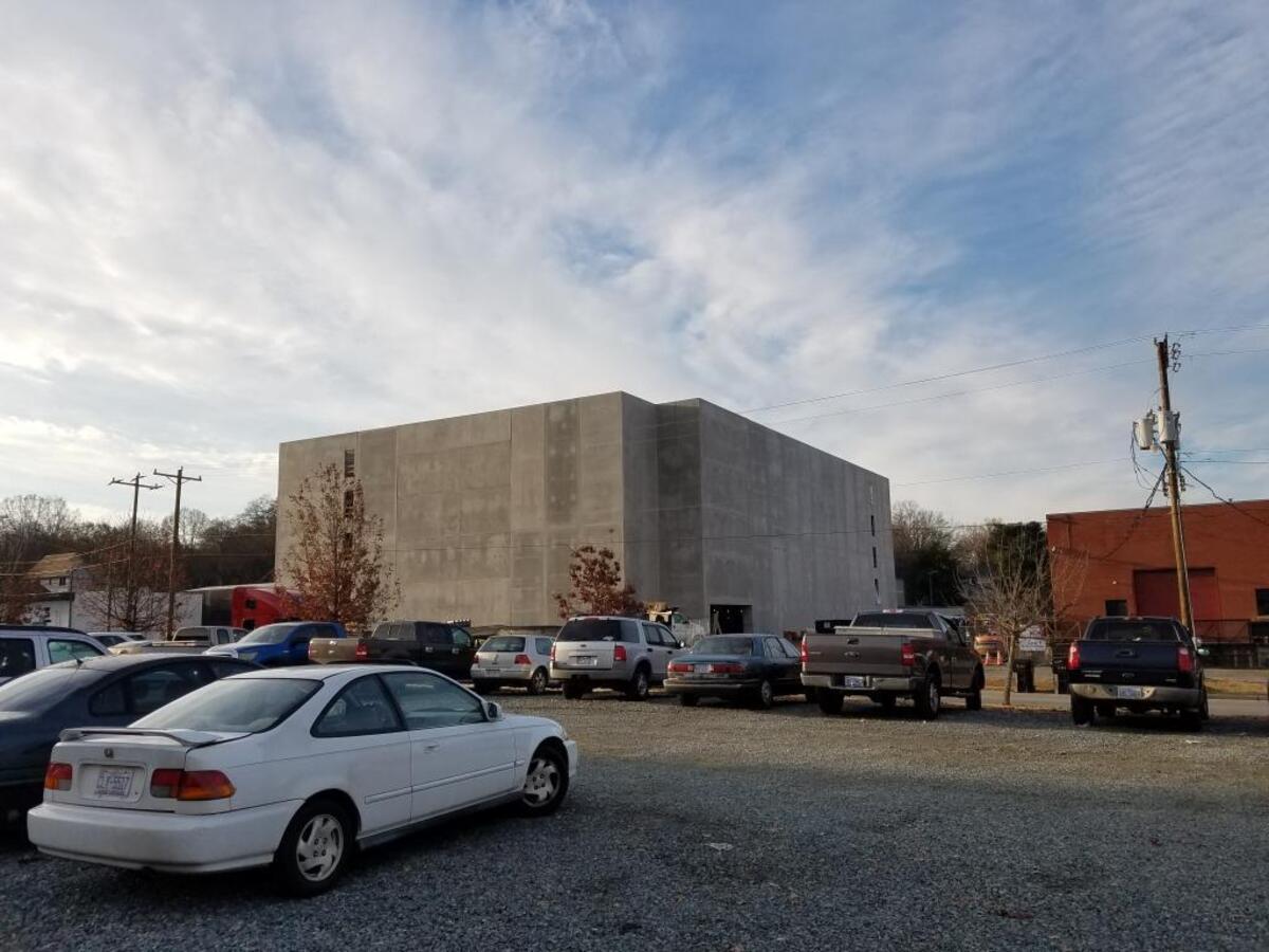 A concrete parking garage under construction at 25th and North Davidson streets, along the Blue Line extension.