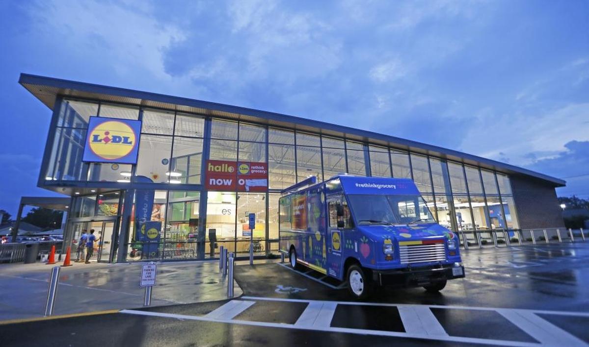 Workers put finishing touches on a new Lidl grocery store in Virginia Beach, Va., last month.
