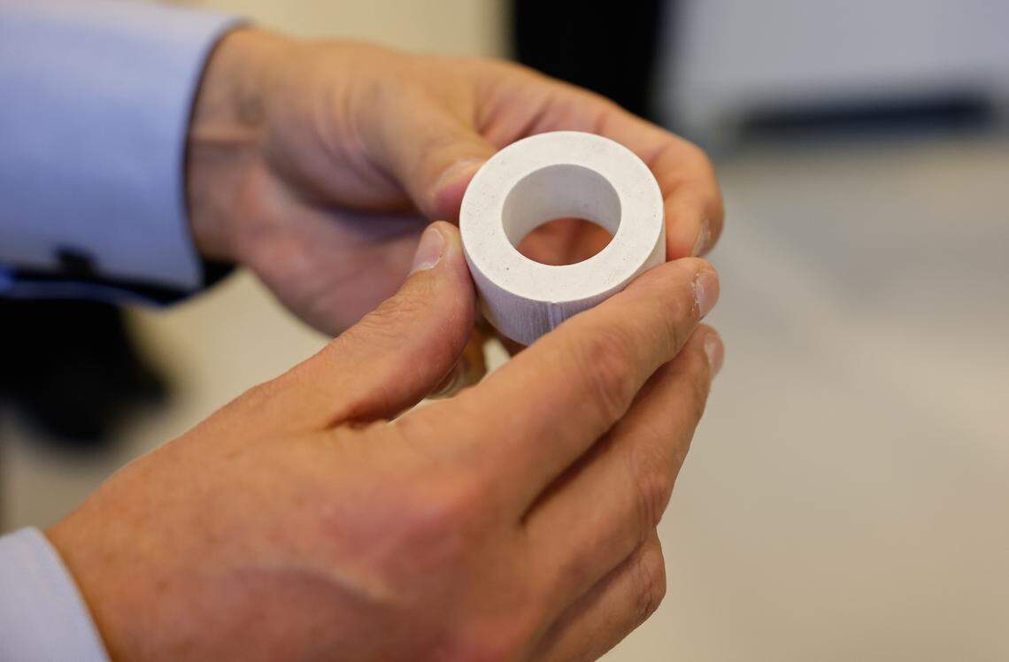 Groninger USA CEO Phillip Hauser holds a mold that was cut out by a water pressure machine on Monday, December 2, 2024, at the Charlotte manufacturing facility.