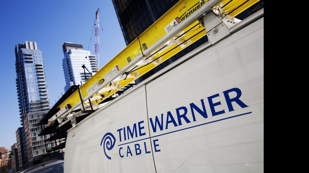 
A Time Warner Cable truck is parked in New York. Charter Communications Inc. is near an agreement to buy Time Warner Cable Inc. for about $55.1 billion in cash and stock, according to people familiar with the matter.
