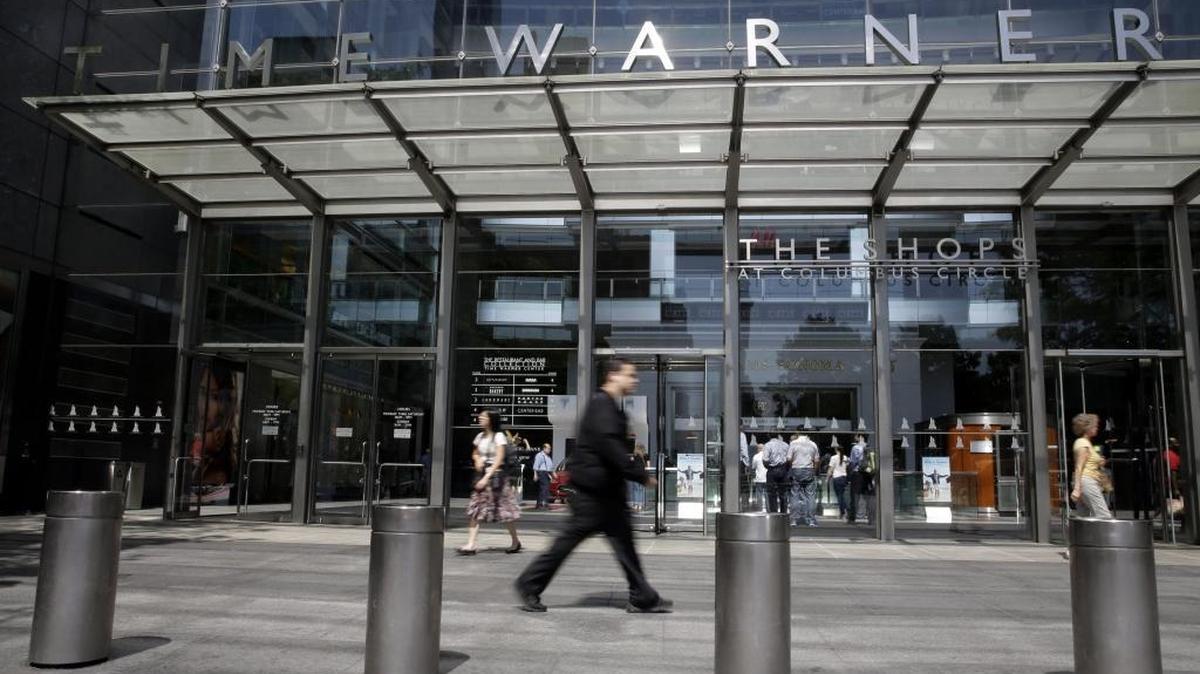 
Pedestrians walk past the Time Warner Center, home of the headquarters of Time Warner Cable, on May 26 in New York. 
