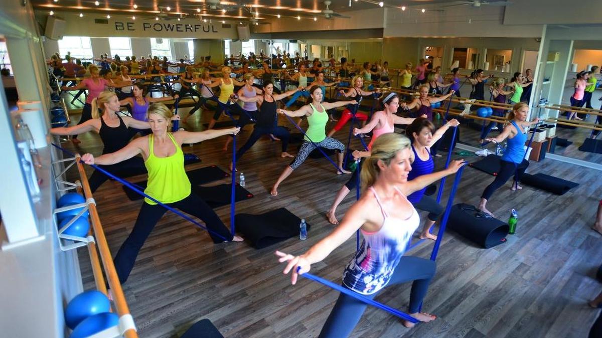 Women participate in an exercise class at Hilliard Studio Method Wednesday, July 23, 2014.