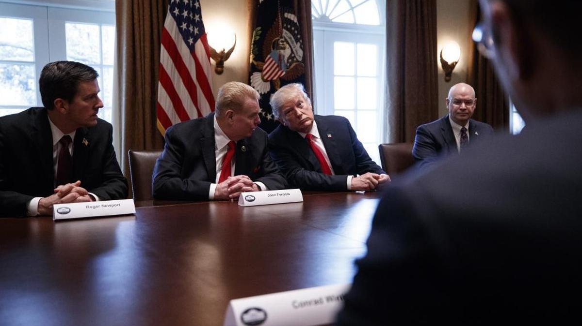 President Donald Trump listens to John Ferriola, chief executive of Charlotte-based Nucor, during a roundtable discussion on foreign trade and steel production with corporate leaders inside the Cabinet Room of the White House in Washington Thursday. President Trump said on Thursday that he will impose stiff and sweeping tariffs on imports of steel and aluminum as he moved to fulfill a key campaign promise to get tough on foreign competitors. From left: Roger Newport, chief executive of AK Steel Holding Corporation; John Ferriola, chief executive of Nucor; Trump; and Dave Burritt of U.S. Steel.