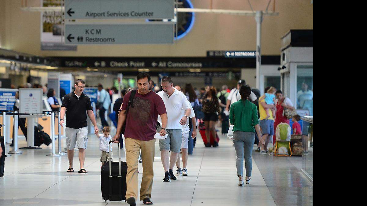 
Travelers make their way through Charlotte Douglas international Airport Thursday June 18, 2015.
