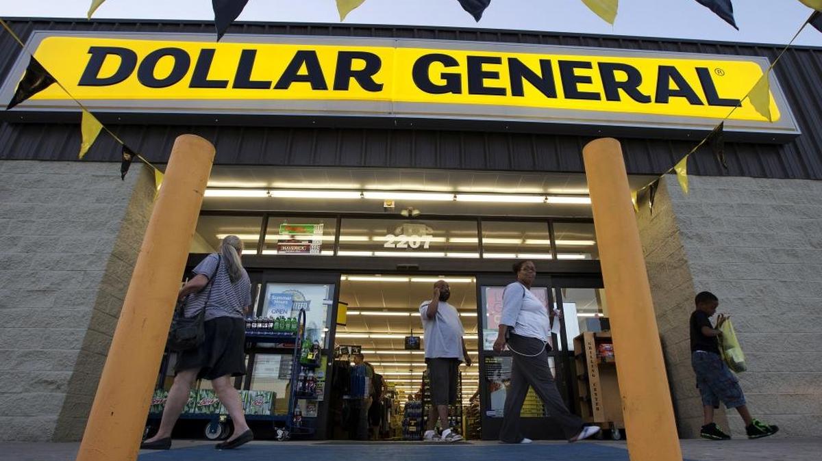 In this Sept. 25, 2013, file photo, customers exit a Dollar General store in San Antonio. Dollar General plans to add nearly 2,000 stores in the next two years, bringing the total to more than 14,000, the company said Thursday.