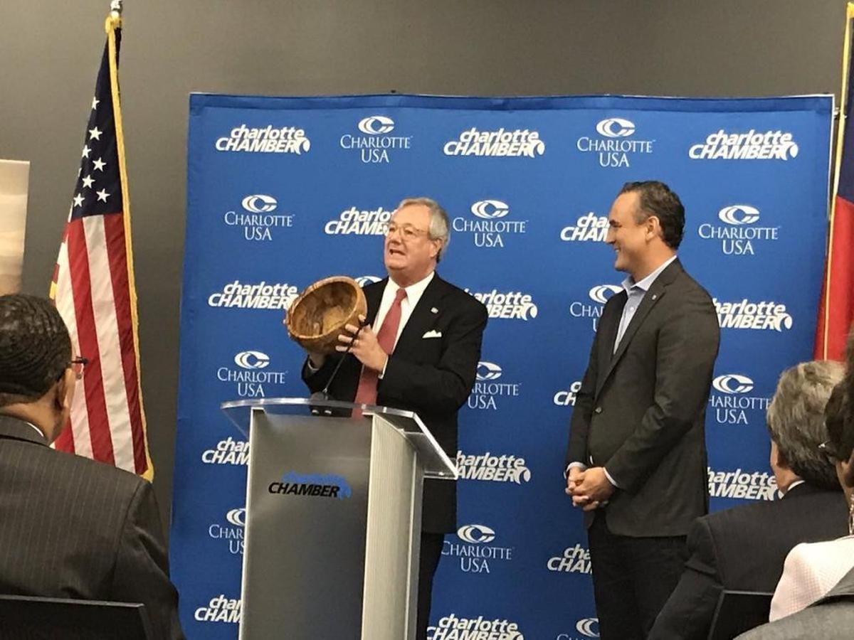 In November, LendingTree CEO Doug Lebda (right) announced plans to nearly double his company’s workforce of about 360 employees. Here he appears at the announcement with John Skvarla, the state commerce secretary at the time.