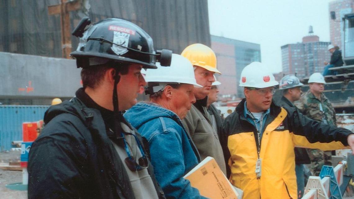 David Griffin Jr., in yellow jacket, on the site of the collapsed World Trade Center towers shortly after the attacks of Sept. 11, 2001. His family company, D.H. Griffin Wrecking Co. Inc., wound up being hired as the lead demolition contractor clearing the rubble from the site, a job that kept the company there for nearly 19 months.