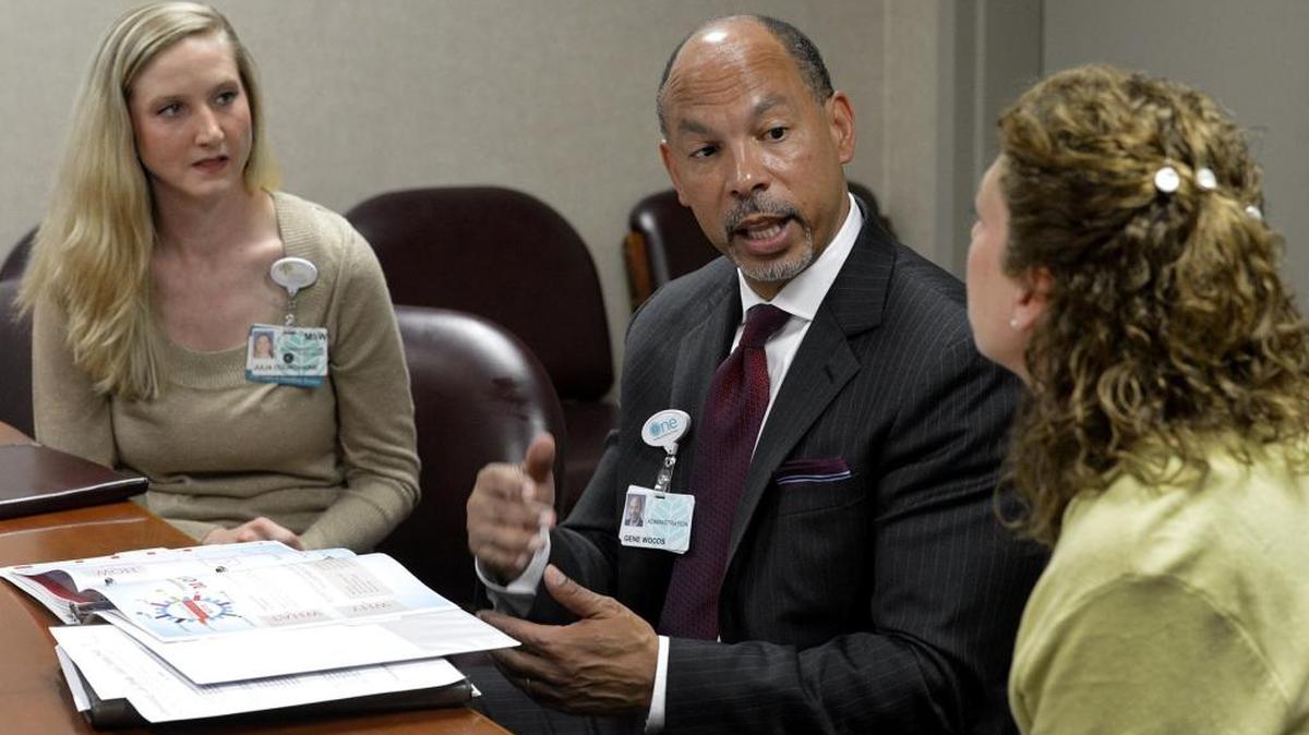 Atrium Health CEO Gene Woods, center, is shown in this file photo. On Thursday, the Charlotte-based hospital system disclosed what Woods and other top executives were paid in 2017.
