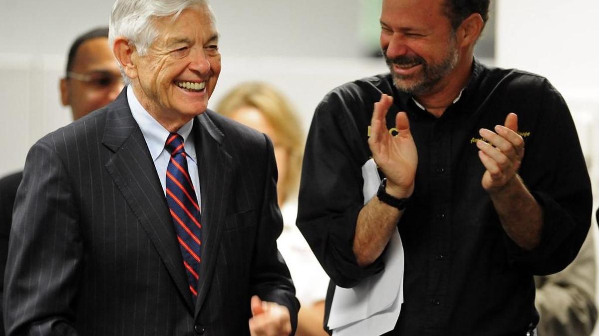 In this file photo, retired Bank of America CEO Hugh McColl Jr. makes an appearance with Bruce Marks, CEO of Neighborhood Assistance Corporation of America. Bank of America funds mortgages for NACA’s affordable mortgage program.