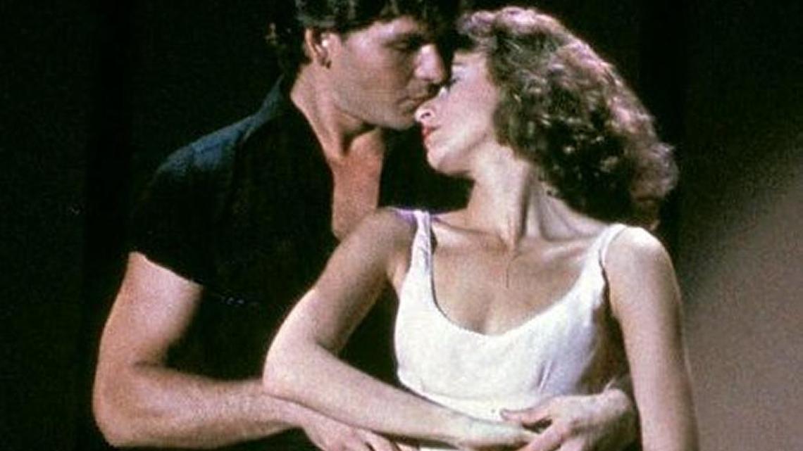 In this image provided by Lionsgate Home Entertainment, Patrick Swayze, portraying Johnny Castle, and Jennifer Grey, portraying Baby Houseman, are shown in a scene from the film, "Dirty Dancing." Lionsgate, which is set to film a remake of the movie in North Carolina, is canceling a comedy production in the state over a new LGBT law.